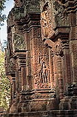 Banteay Srei temple - sculpted male guardian in niches